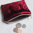 Burgundy pouch purse with embossed velvet border and linen design with zip top. 