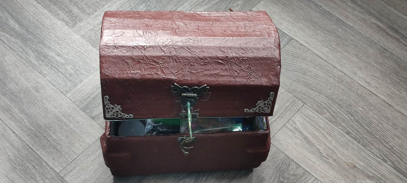 chest filled with goodies for pagan alternative spiritual person candles incense