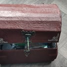 chest filled with goodies for pagan alternative spiritual person candles incense