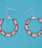 Hoop earrings threaded with dusky pink paper beads - Image 2
