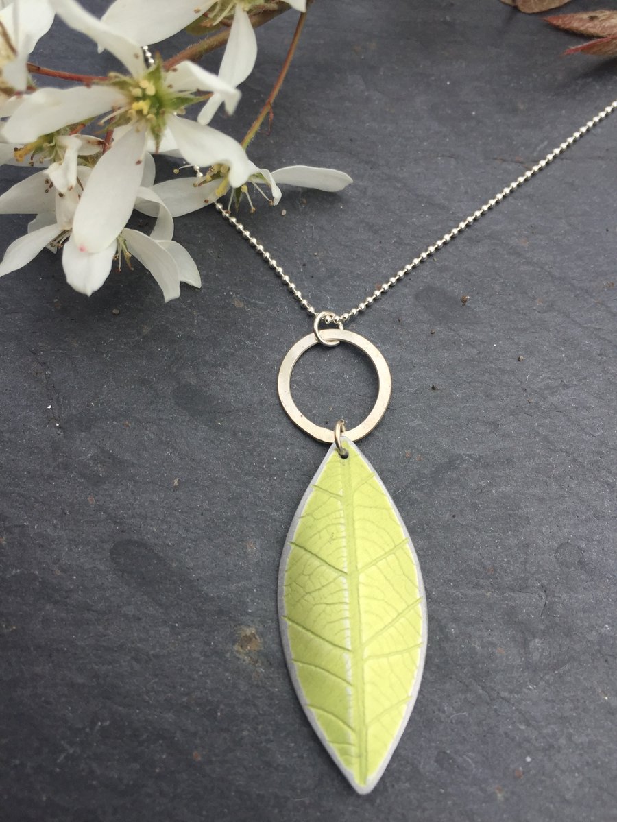 lime green anodised aluminium distressed leaf pendant with silver ring