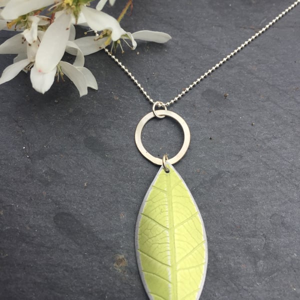 lime green anodised aluminium distressed leaf pendant with silver ring