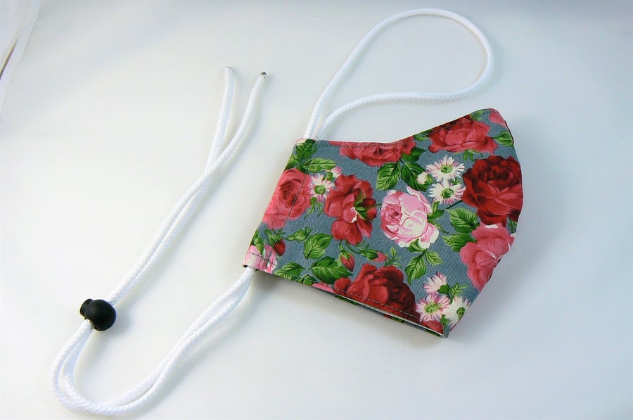 Face mask with removable nose wire , filter pocket  and drawstring toggle