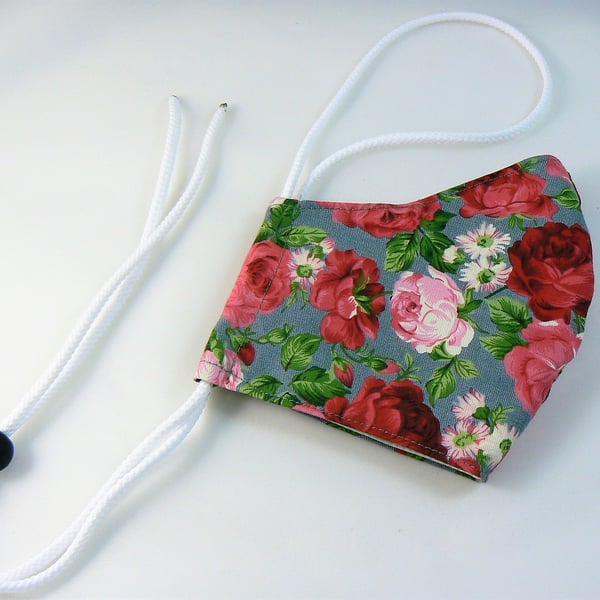 Face mask with removable nose wire , filter pocket  and drawstring toggle