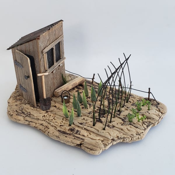 'The Allotment' driftwood garden, veggie patch scene.