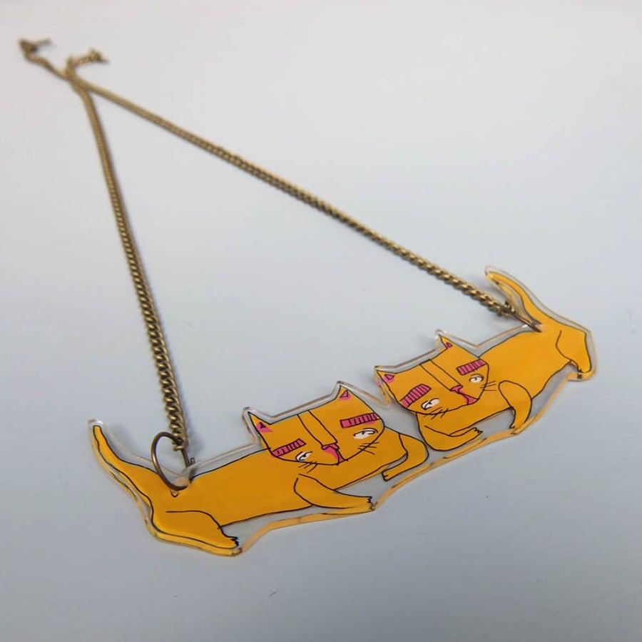 Mustard 'Weird Kitty' illustrated pendant