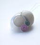Circle pendant in brushed aluminium with pink and turquoise discs - Image 1