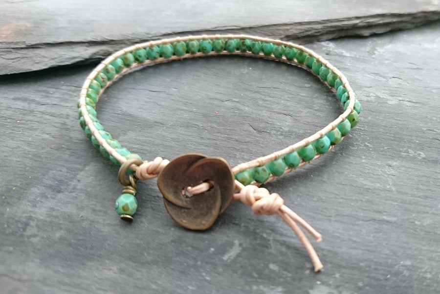 Champagne metallic leather and green faceted glass bead bracelet, flower button
