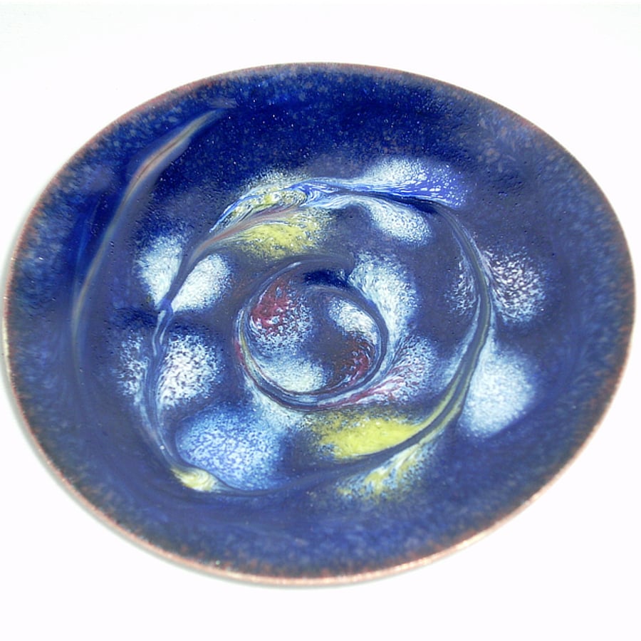 enamel dish: scrolled white, red, yellow on blue over clear enamel