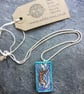 Handmade Ceramic Otter pendant in turquoise blue - Image 2