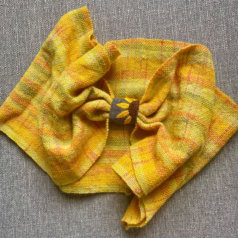 Woven cowl indie dyed yarn in yellow with a sunflower embroidery design
