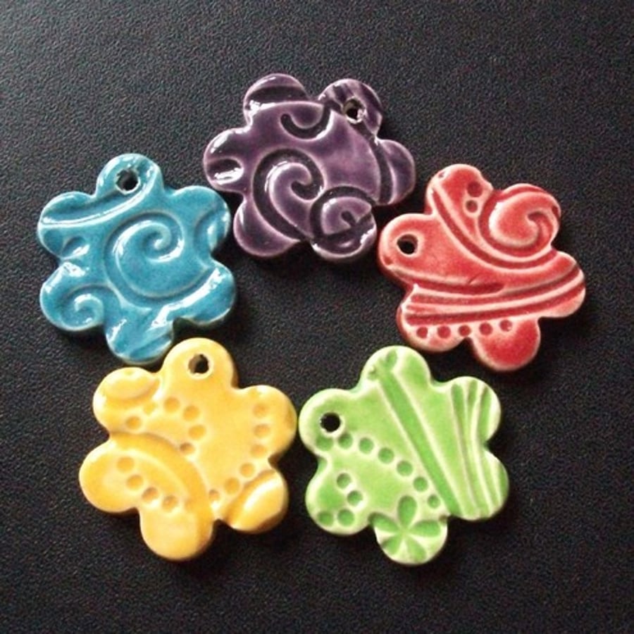 Set of five multicoloured ceramic charms