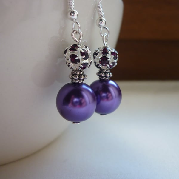 PURPLE AND SILVER RHINESTONE EARRINGS.  622