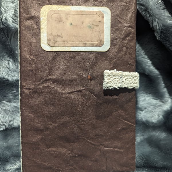 Brown handmade paper covered journal with lace spine