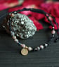 Macrame black bracelet with natural stone Rhodonite with brass coin