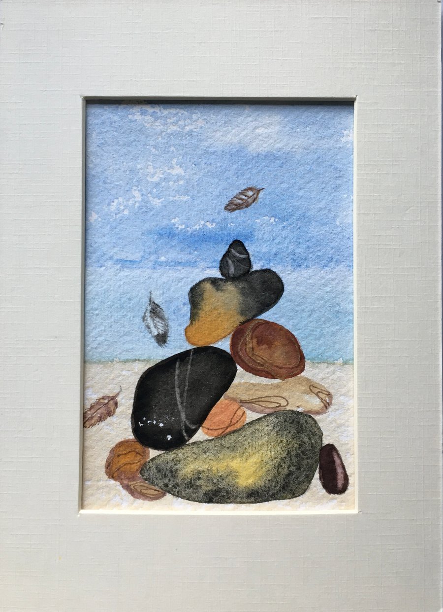 Pebbles and small feathers art 