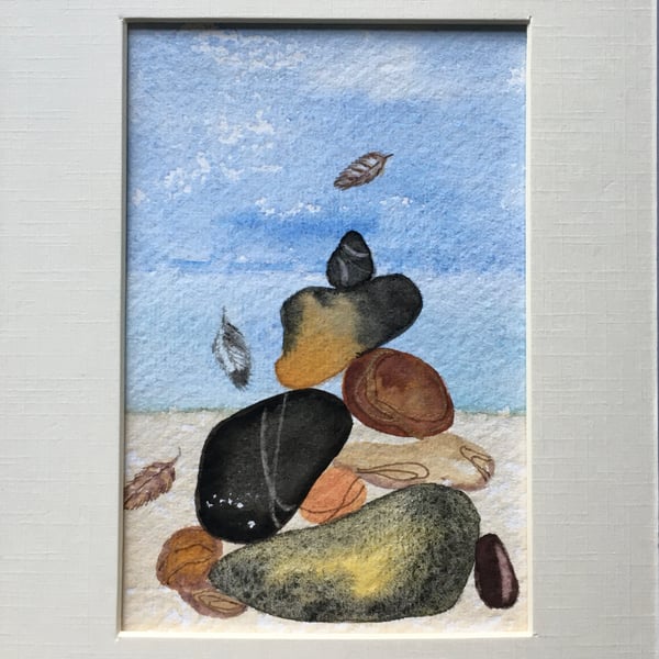 Pebbles and small feathers art 