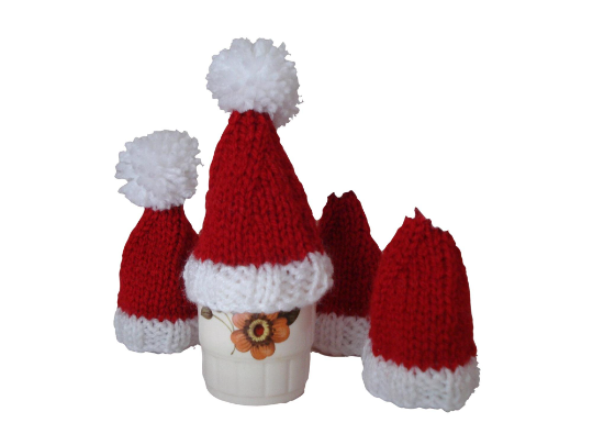 Set Of Four Egg Cosies In The Shape of Santa Hats With White Bobbles (A640)