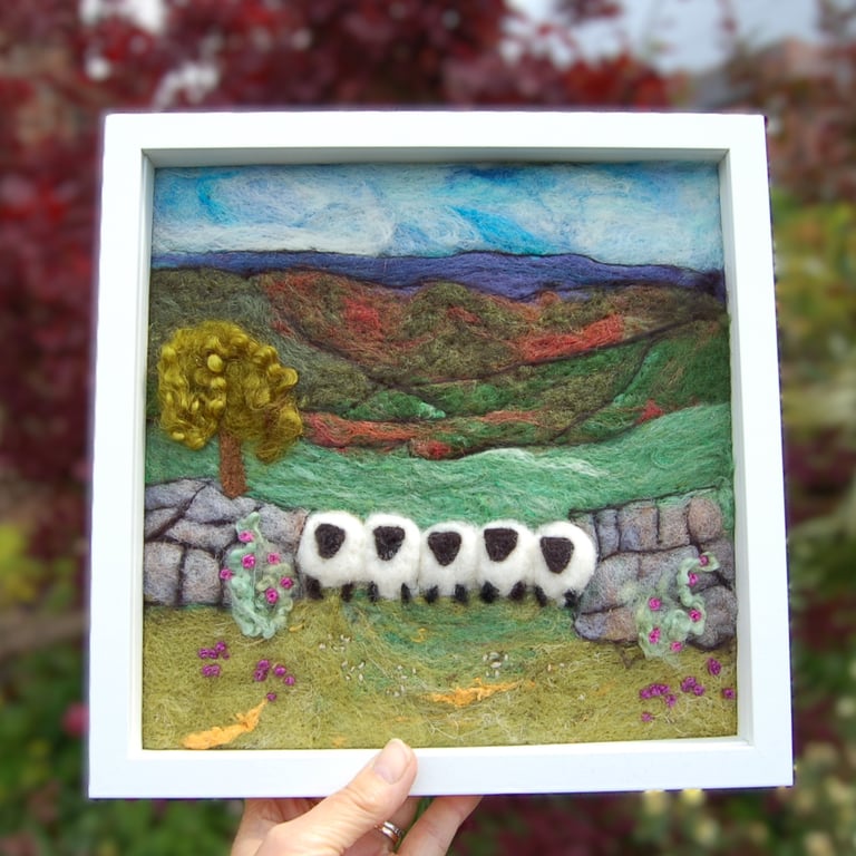 Sheep by a dry stonewall wool painting.  Needlefelt picture with hand embroidery