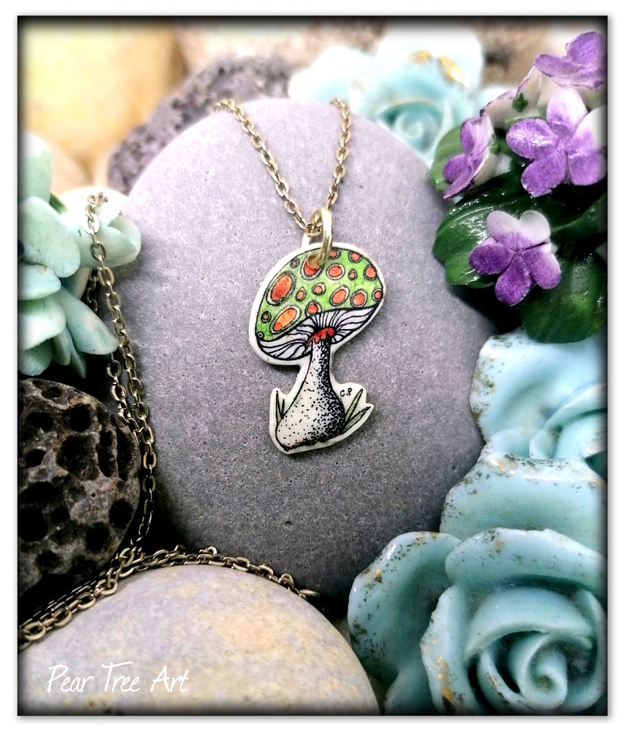 Handmade Toadstool pendant on a silver plated chain, green and red