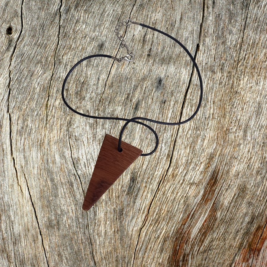 Handmade wooden pendant is crafted from reclaimed teak