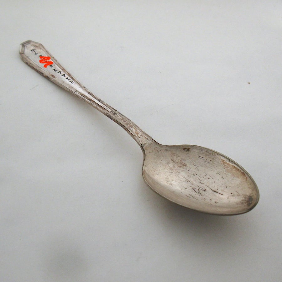 Very rude word handstamped old spoon