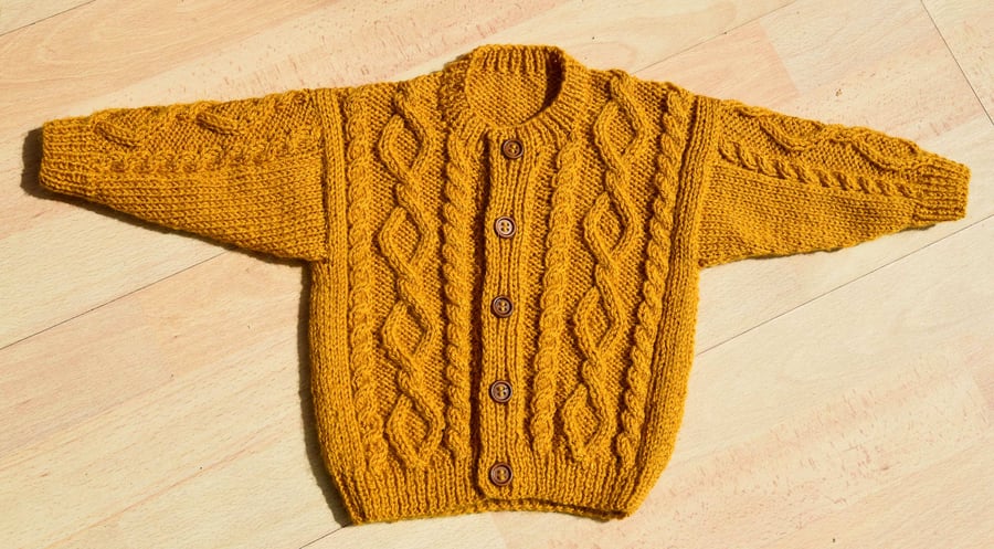 hand knitted cable baby cardigan 6 to 12 months in mustard