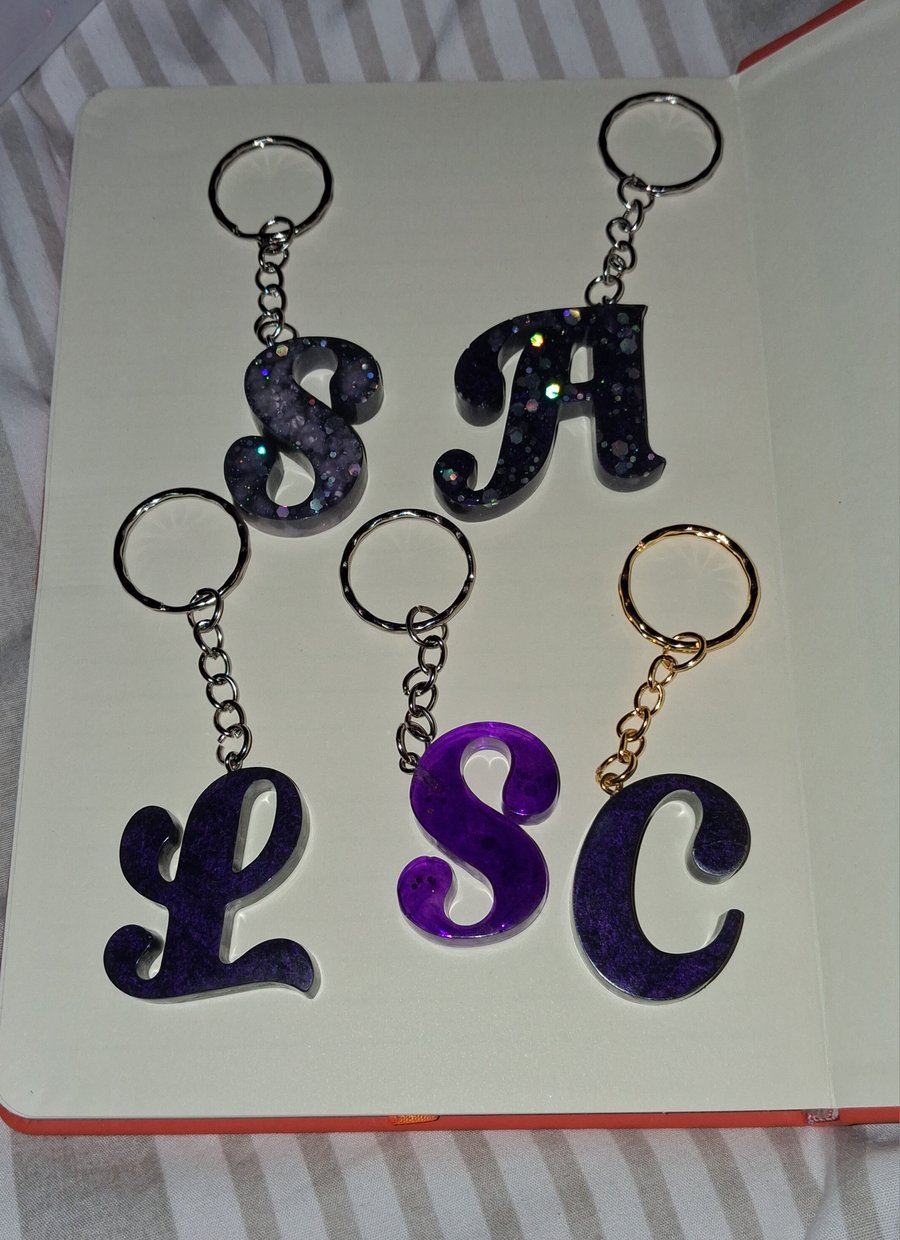 Purple handmade epoxy resin keyrings with initial letter
