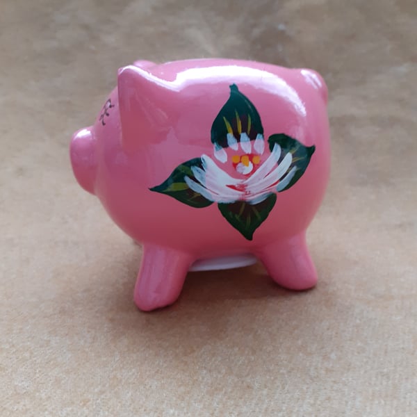 Pink piggy bank with canal art style roses