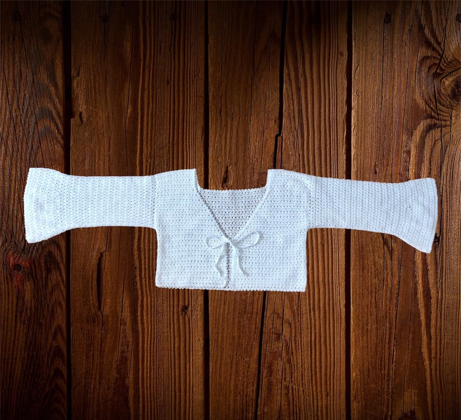 Bolero crochet crop top with bell sleeves. Colour white. U.K. size is medium M.