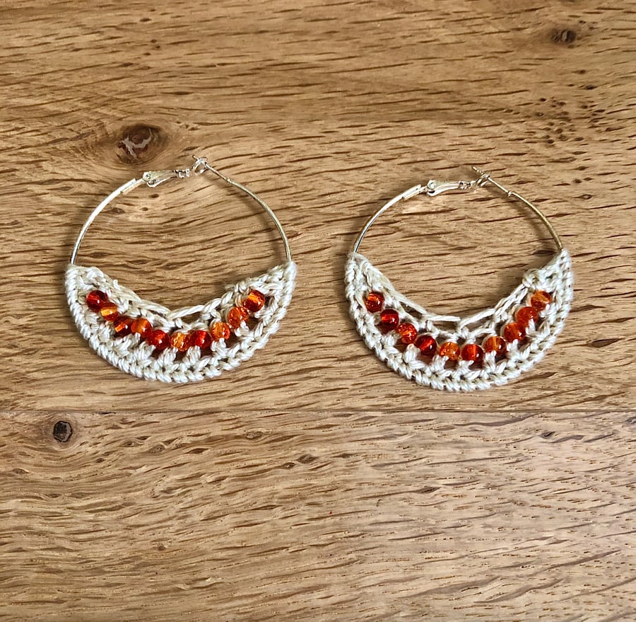 Hello November...silver plated hoop earrings with crochet and topaz design.