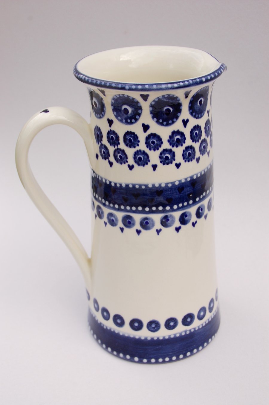 Tall blue and white hand painted jug