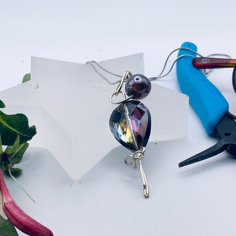 Double crystal, in pink, black and blue, silver pendant