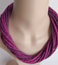 The Twist: felted cord necklace in shades of pinky purple - Image 1