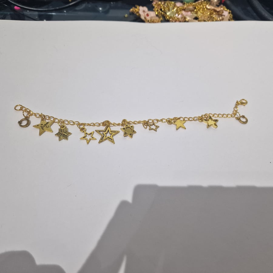 Mixed star charm gold bracelet