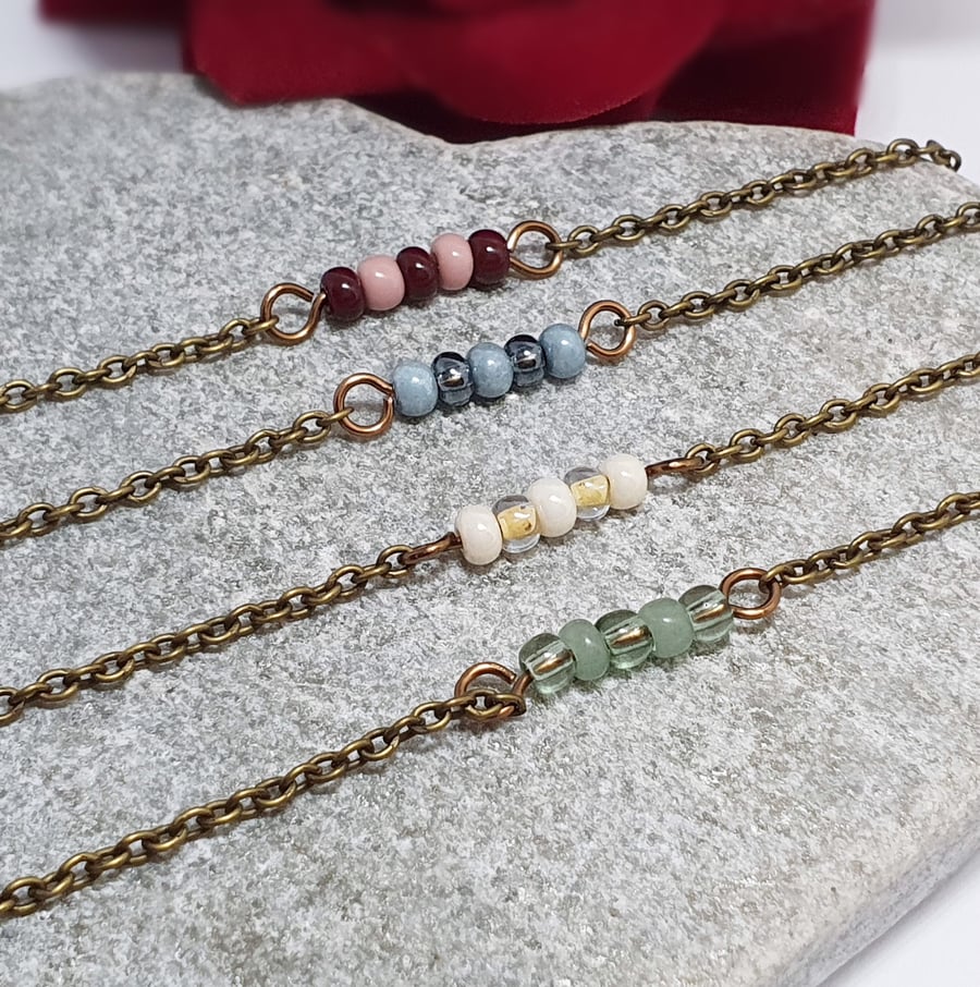 Dainty colourful beaded bar bracelets in blue, pink, yellow and green