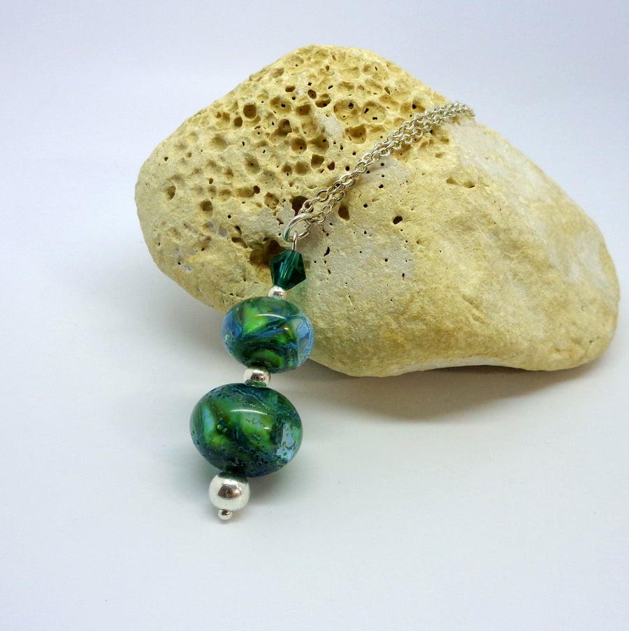 Lampwork glass bead pendant in mixed greens & sterling silver
