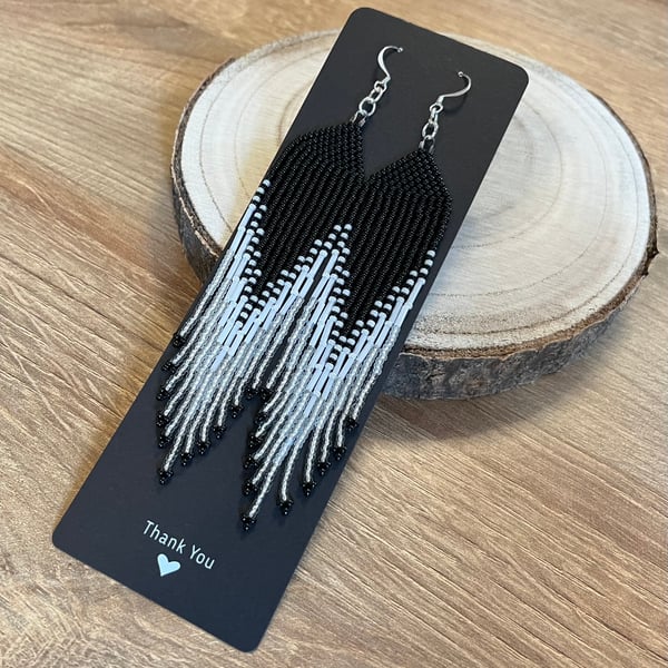 Long black and white beaded fringe earrings 