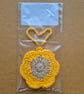 Flower shaped bag charm with small storage space. - Image 2