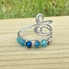 Pretty wraparound ring with sparkly blue beads 