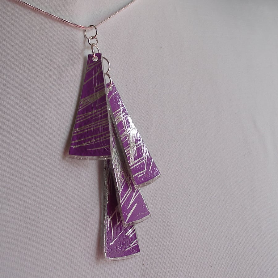 Four piece lilac and silver pendant.