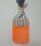 Eye-catching striped patterned Japanese Knot bag with orange 19cm tassel trim.