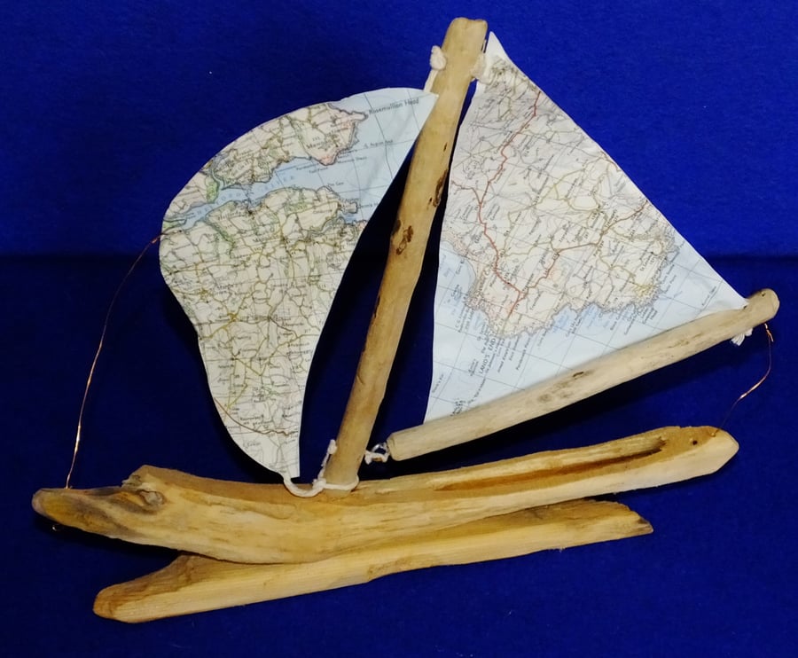 Little driftwood boat with Ordnance Survey map for sail Land's End & St. Austell