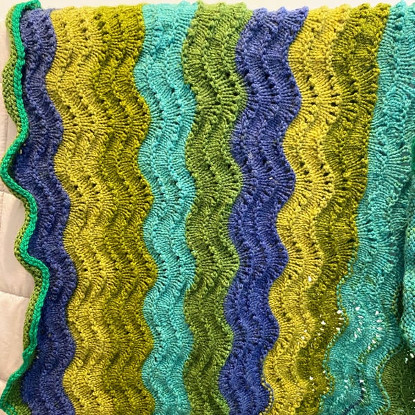 Knitted baby blanket blue and green waves