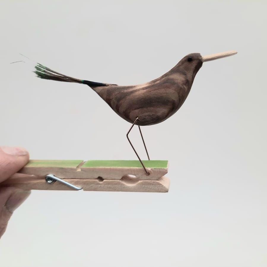 Pecking peg bird