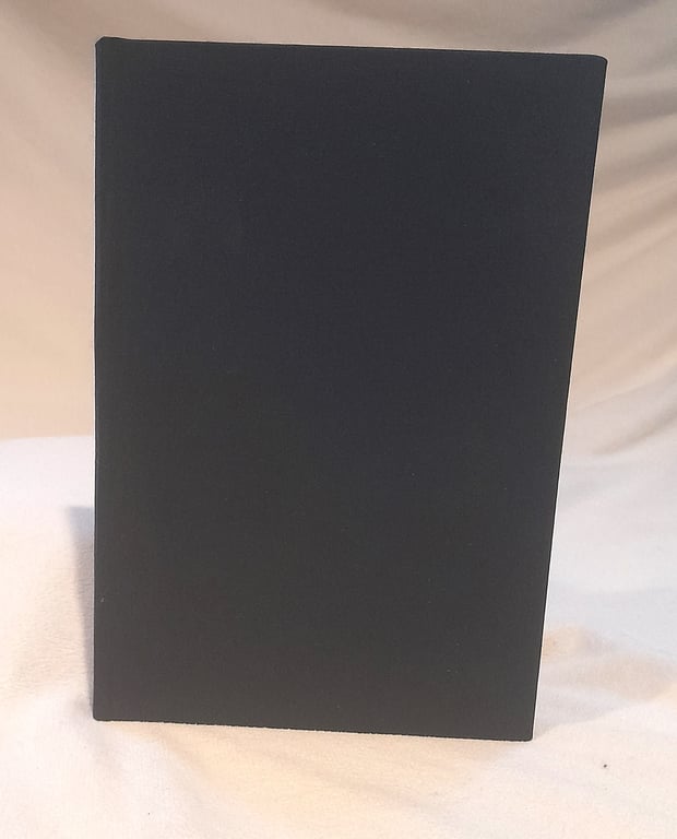 A5 notebook bound with dark blue bookcloth featuring gorgeous floral endpapers