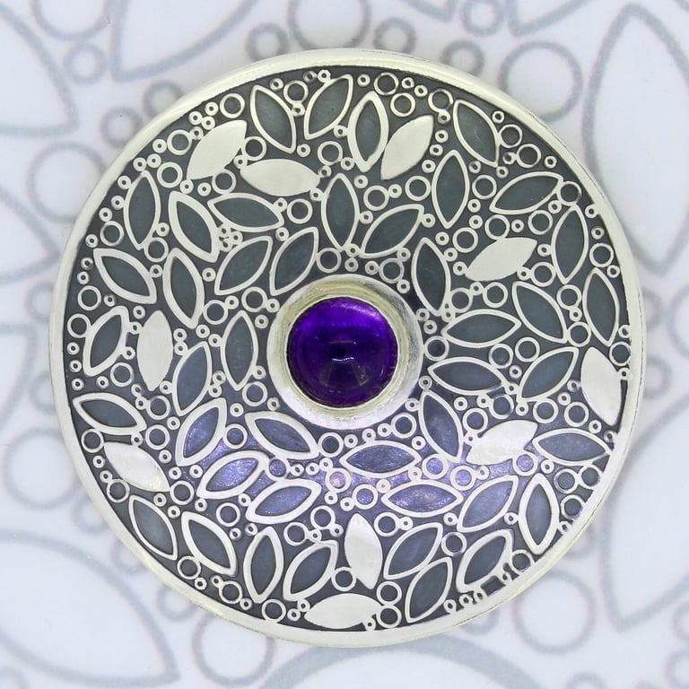 Handmade large sterling silver brooch with an amethyst stone and a leaf pattern.