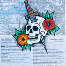 Skull and dagger painting on a map of Plymouth