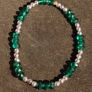 Green beaded bracelet on elastic wire