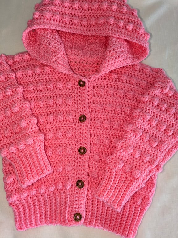 Pink hooded cardigan for a young girl ages two and a half 